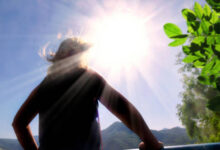 Bright sun with UV rays hitting UV index meaning with sun exposure levels and skin protection guide