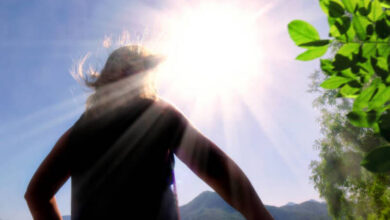 Bright sun with UV rays hitting UV index meaning with sun exposure levels and skin protection guide